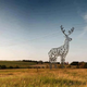 Illustration for article titled These Beautiful Giant Sculptures Support Power Lines With Style